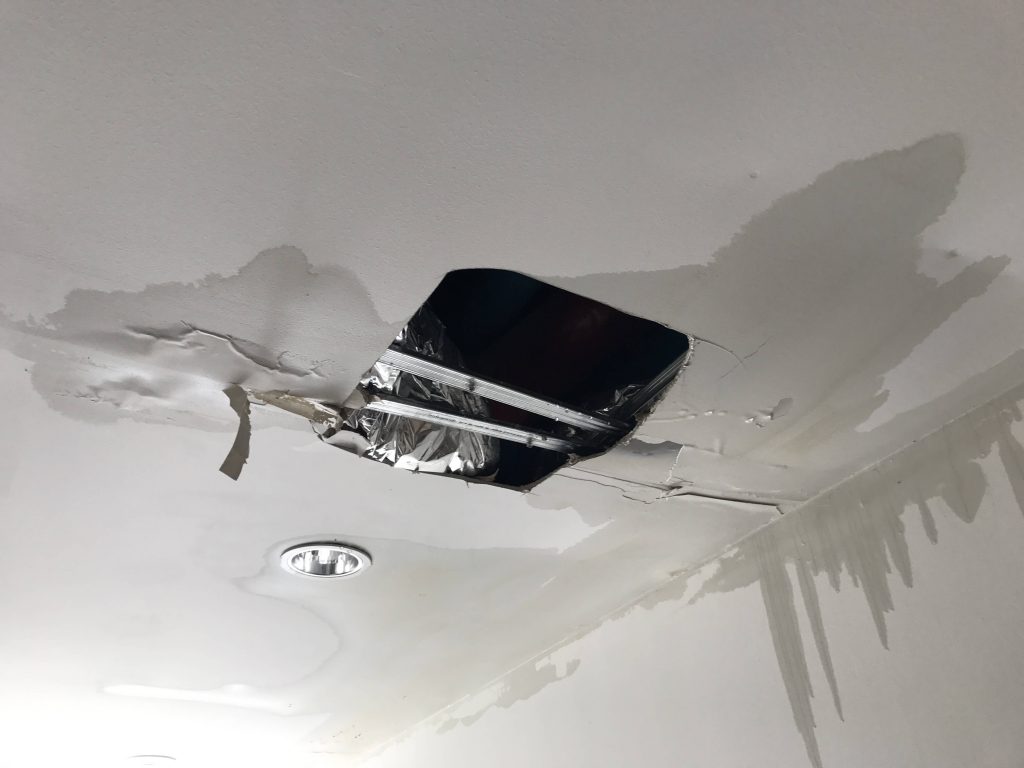 collapsed ceiling as result of a water scape in the pipework