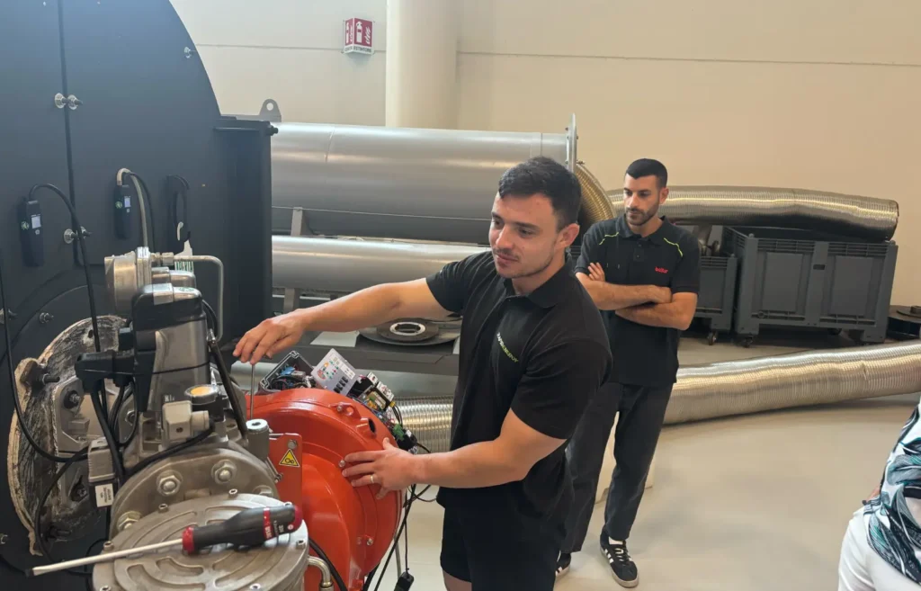 Rapid Energy engineer completing some hands-on burner training in Italy.