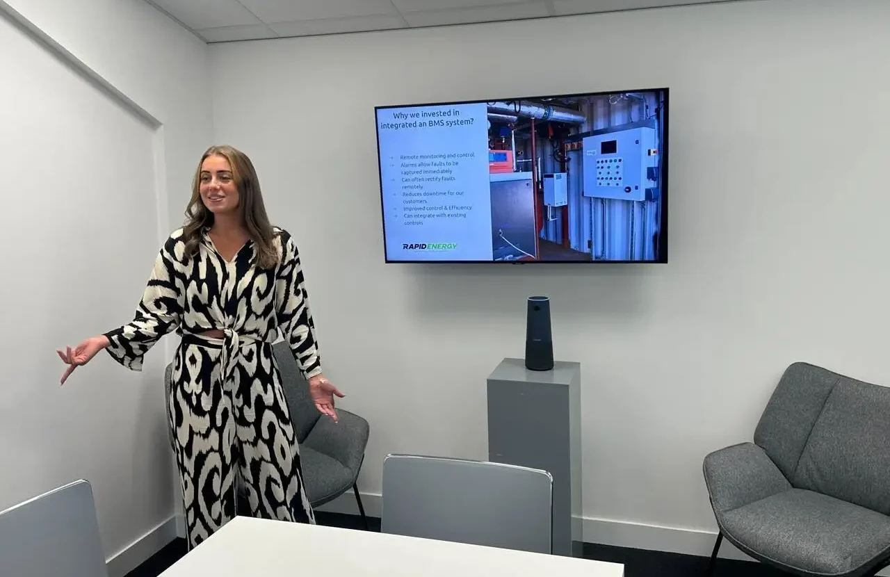 Rapid Energy Business Development Manager Ellie presenting at a client meeting