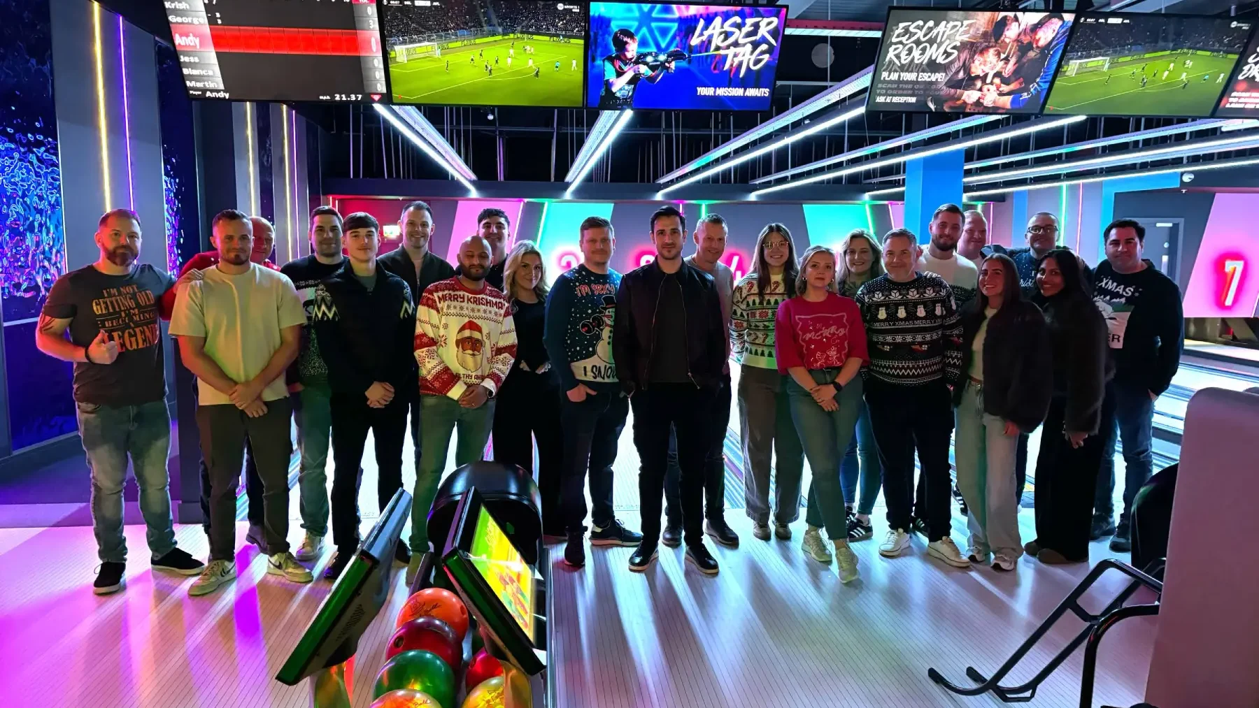 The Rapid Energy Redditch team is at a bowling alley for their Christmas party.