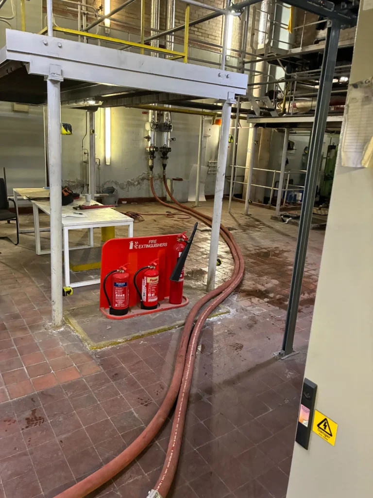 Boiler hosing running along the floor